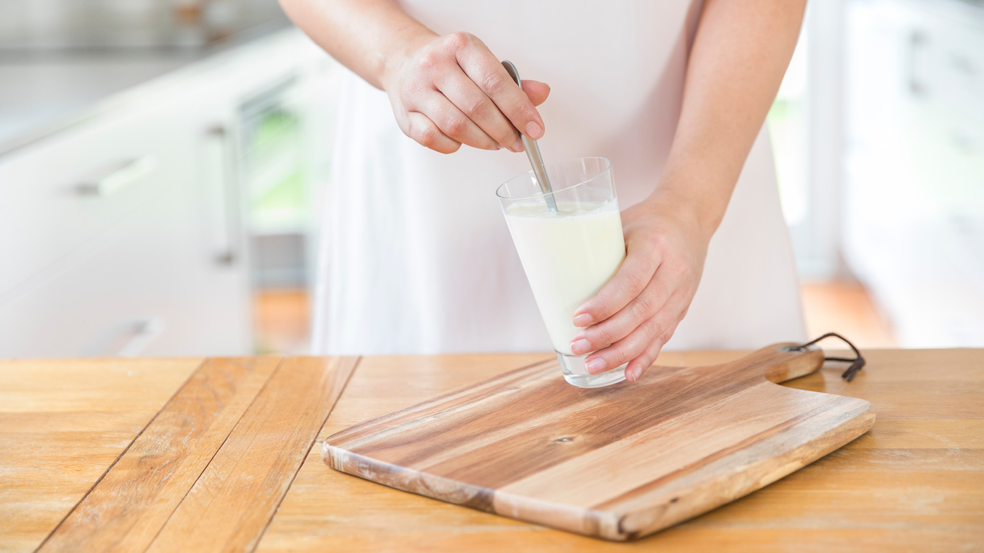 Stirring glass of milk